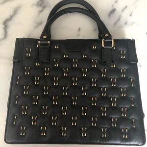 Olivia Harris black leather bag with gold accents